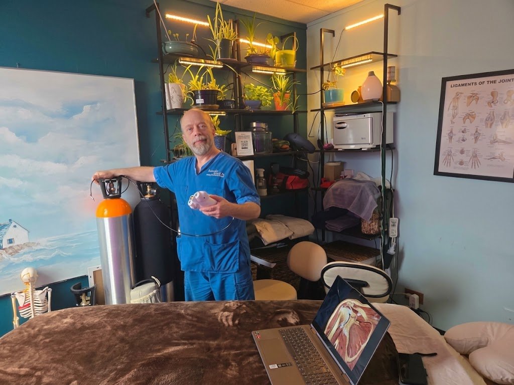 Guy, owner of Graceful Touch Massage Therapy, in the treatment room in Rapid City, SD